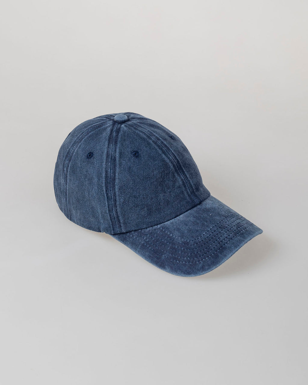Distressed dye effect cap