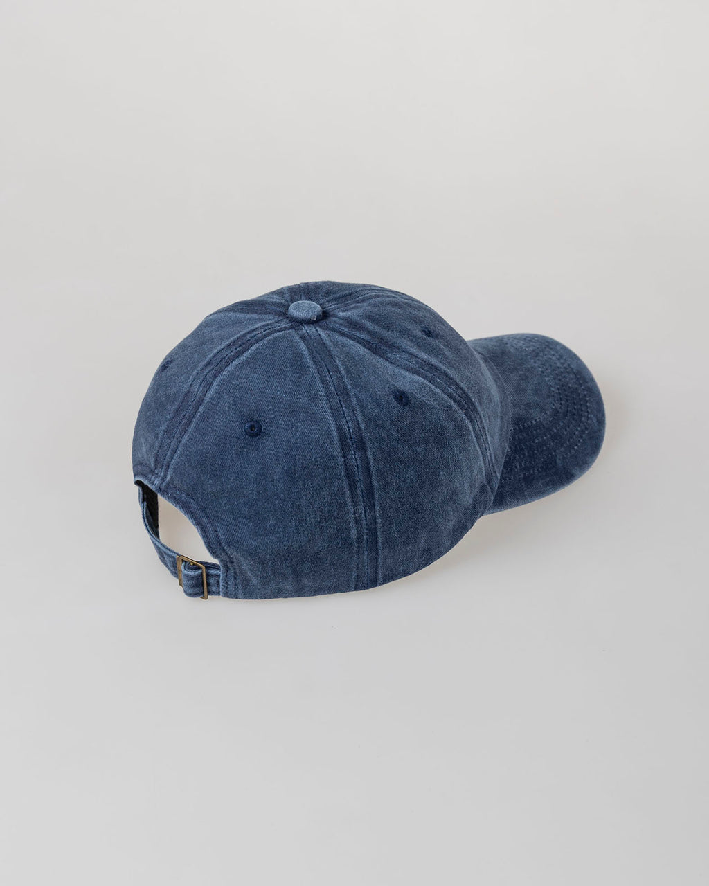 Distressed dye effect cap