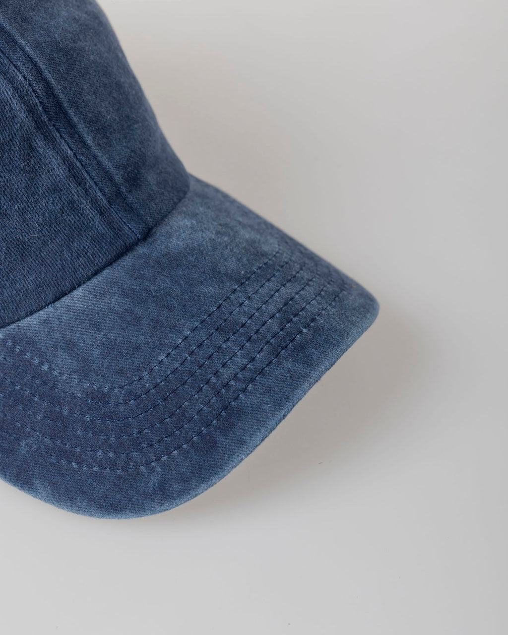 Distressed dye effect cap