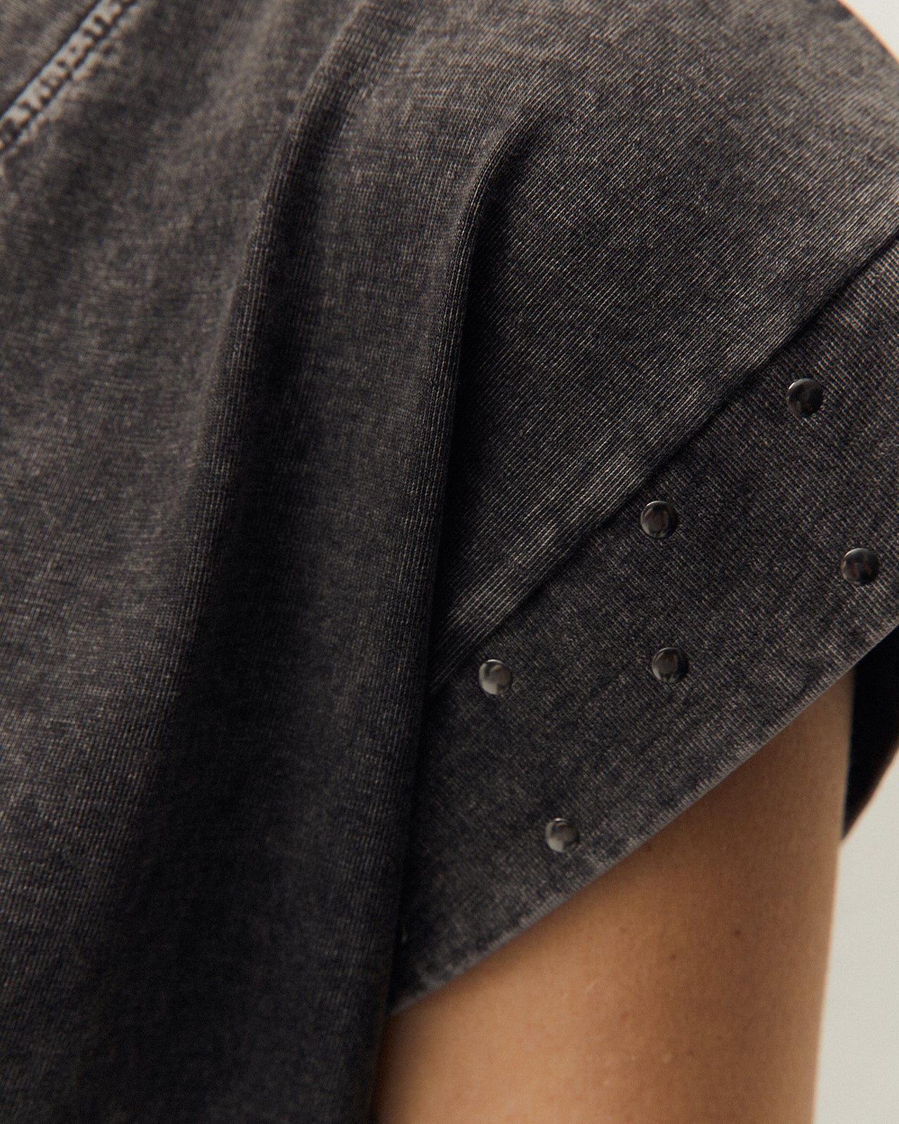 Dress with studs on the sleeves